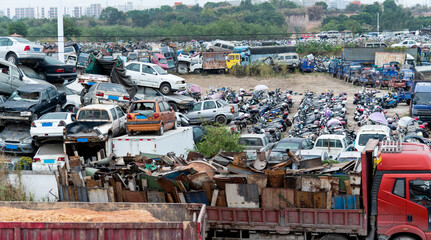 A pile of abandoned cars on junkyard