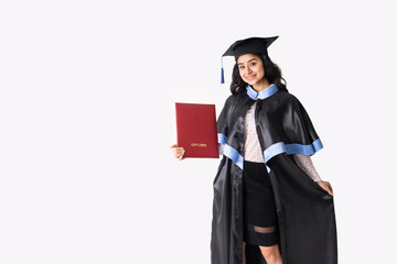 University graduate indian race woman wearing academic regalia and red diploma isolated.