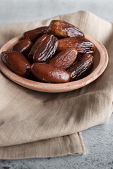 Algerian dates deglet nour on a light background in a bowl