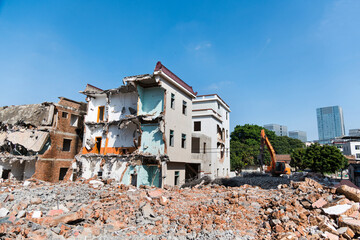 Construction machinery is demolishing the house