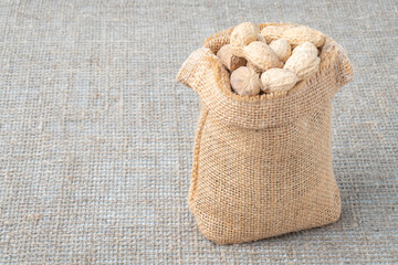 Peanuts on the background of burlap