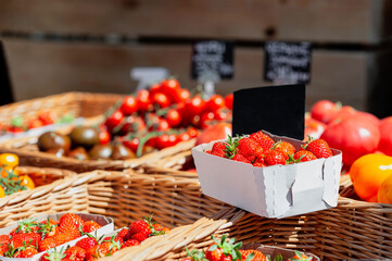 fresh farm fruits, vegetables, berries in eco-friendly paper packaging and wicker boxes.