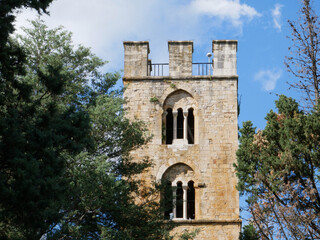 Fototapeta na wymiar Sanctuary of Santa Maria di Canneto - Roccavivara - Molise: Detail of the ancient bell tower with single lancet windows.