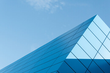 Geometric colored building facade elements with planes, lines and corners with light flare and...