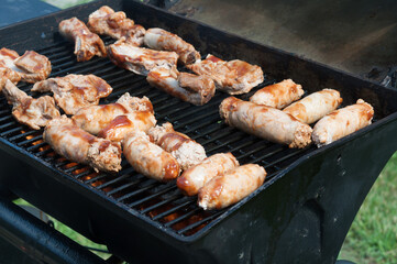 sausages and other meats on the grill