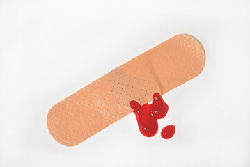 band aid with blood drop