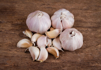 Garlic on old wooden table background. vintage styles