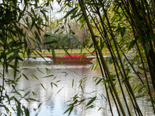 Naklejka premium Boat on the water in the park.