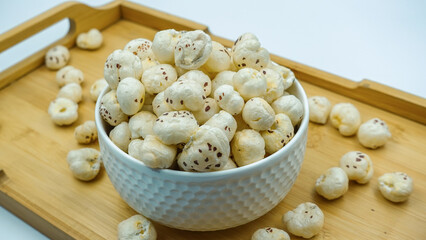 Flavored Prickly Water Lily. Dried makhana also known as water lily. Fox nut. Makhanas. Lotus seeds. The edible seeds, called fox nuts or makhana when dried, are eaten in Asia.