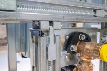 the process of plumbing installation. metal toilet seat mounts.