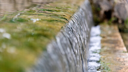 Water running down the stone step