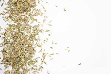 Pile of cumin seeds isolated on white background, top view.