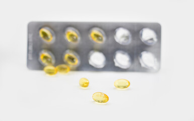 Omega 3 fish oil capsules isolated on a white background