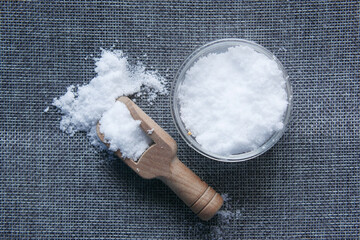 Coarse salt in a bowl on table 