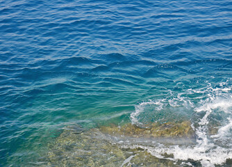 Fototapeta na wymiar Crystal clear sea water on the Ligurian coast in Italy