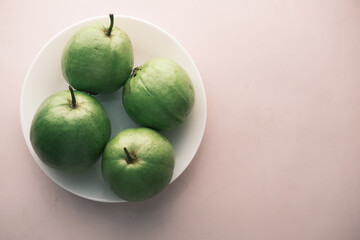 close up of slice of guava on table 