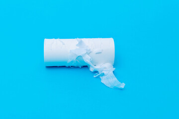 Empty toilet roll on blue background