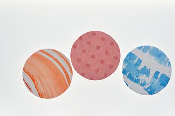 set of paper circles with patterns on a white background