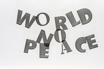 transparency with laser printed letters forming the words "world no peace" on a white background