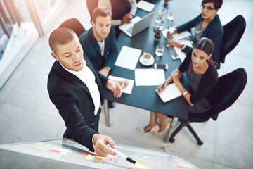 This is how we will transform the company. Shot of businesspeople having a meeting in a boardroom.