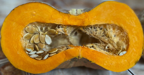 A half of orange pumpkin. Pumpkin seeds are really healthy kind of nutrition