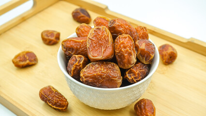 Dates also known as Khajur. Tasty dry dates isolated on white background. Arabic food that muslims eat during Ramadan. Super dietery food. 