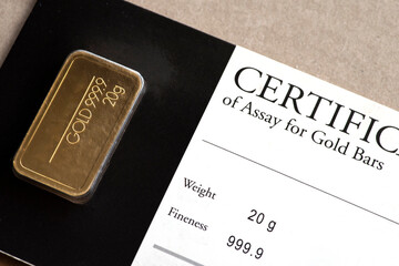 Minted gold bar weighing 20 grams  in blister package with certificate.