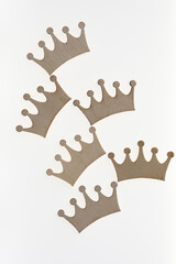 wooden crown ornaments on a white background