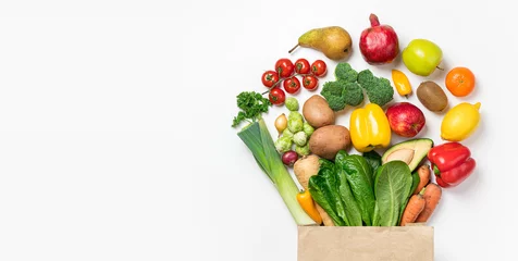 Gordijnen Healthy food background. Healthy food in paper bag vegetables and fruits on white. Food delivery, shopping food supermarket concept © missmimimina