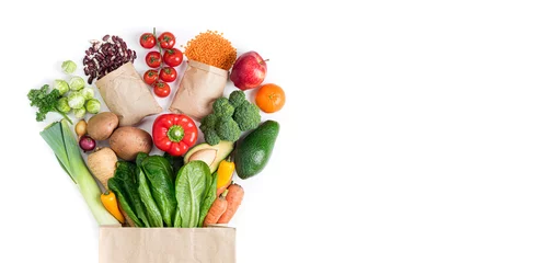 Gordijnen Healthy food background. Healthy food in paper bag vegetables and fruits on white. Food delivery, shopping food supermarket concept. Copy space © missmimimina