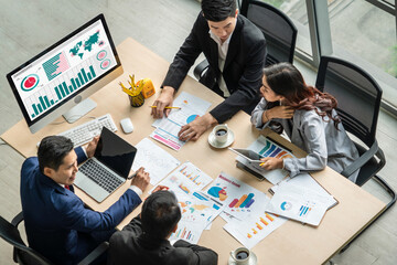 Business data dashboard analysis by ingenious computer software . Investment application display business sales and profit on the computer screen and advise marketing planning decision .