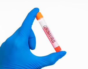 Fototapeta premium Hand holding blood test tube with word CORONAVIRUS