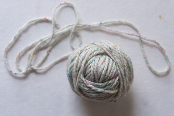 ball of yarn on a paper background