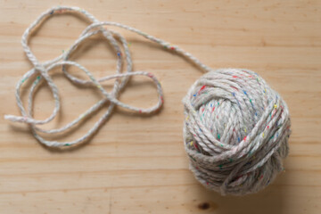 ball of yarn on a wooden surface