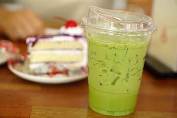 Green tea and cake on a table in a cafe               