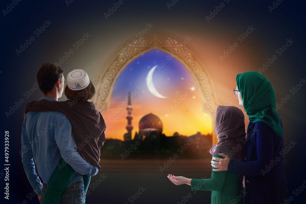 Wall mural ramadan kareem greeting. family looking at mosque.