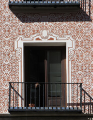 Detail of facade with sgraffito geometric decoration in the historic city center of Madrid. Spain. 