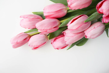 Obraz premium bouquet of spring flowers. bouquet of pink tulips on a white background and space for text