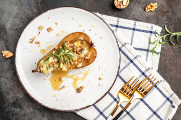 Pears baked with blue cheese, nuts and honey. French cuisine. Keto diet. Vegetarian lunch. Long banner format. top view