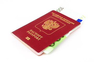 Russian passport and a 100 euro banknote isolated on white background. Concept of currency restrictions for Russia or bribe. Restrictions on the export of currency abroad. Selective focus