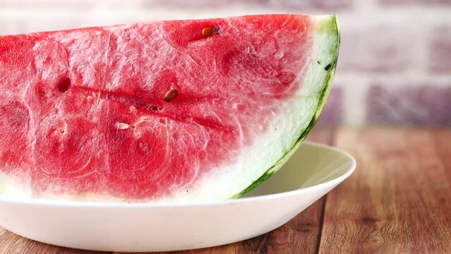 close up of slice of water melon on a plate 