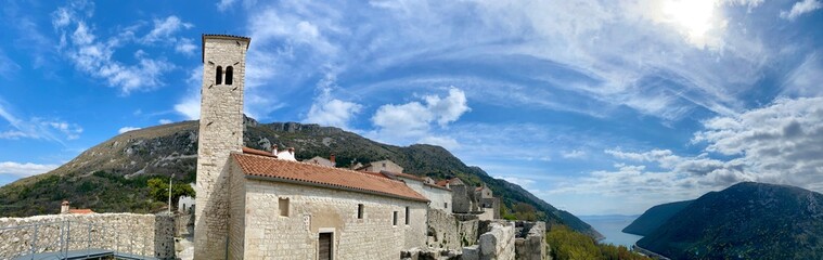 Fototapeta na wymiar panoramic view of Plomin channel and bell tower, Istria, Croatia