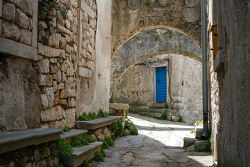 Ancient abandoned medieval town Plomin, Istria Croatia.  Old stone street with ruined walls houses...