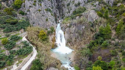 Fototapeta na wymiar Cascada de cañón del tipo torrencial en Alicante, Estret de les Penyes o Estrecho de las Peñas