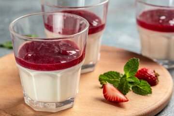 Italian dessert panna cotta with strawberry decorated with fresh berries. homemade dessert panna cotta. Food recipe background. space for text