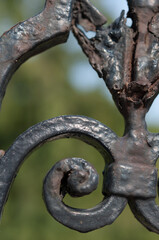 rusty, decaying wrought iron metal work close up