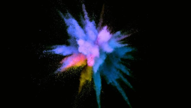 Super slow motion of colored powder explosion isolated on dark background. Filmed on high speed cinema camera, 1000fps.