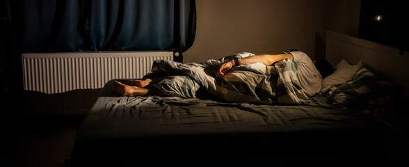 man sleeping in bed at night sleep quality  insomnia