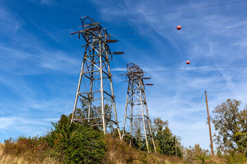 
Sunny summer landscape with old power transmission towers