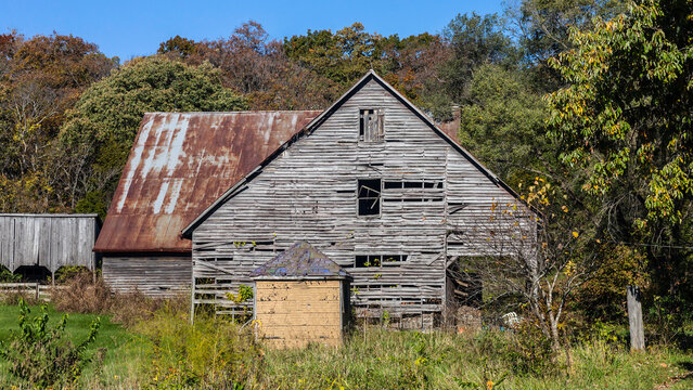 Rural countryside farm landscape with aging dilapidated barn